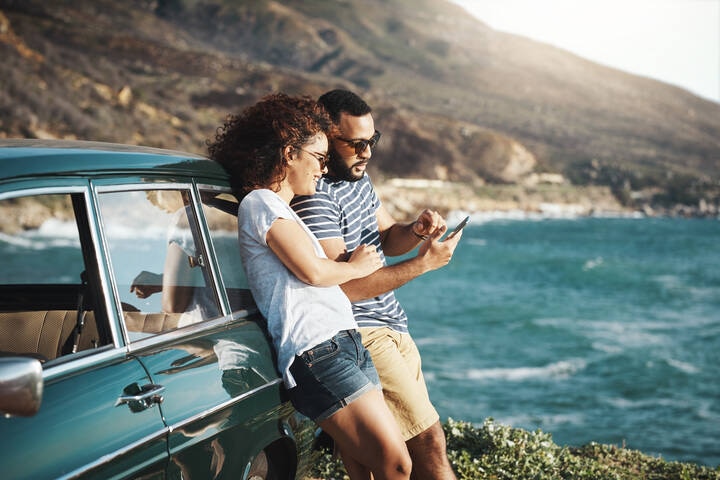 Couple taking a selfie whilst parked